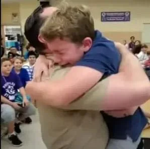 Boy Spots Navy Dad in Back of Cafeteria and Takes Off Running