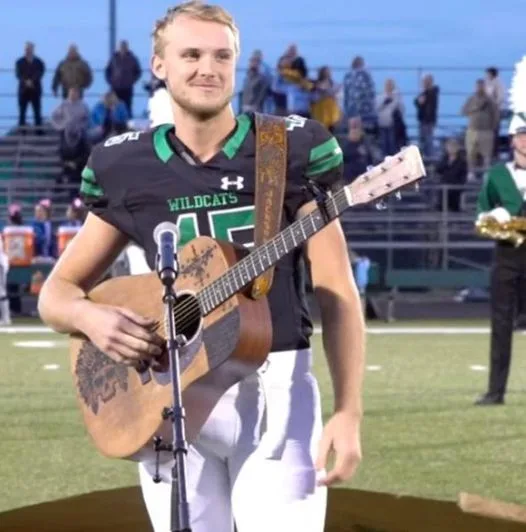 No one was willing to sing the national anthem, so one high schooler took off his helmet and grabbed a guitar