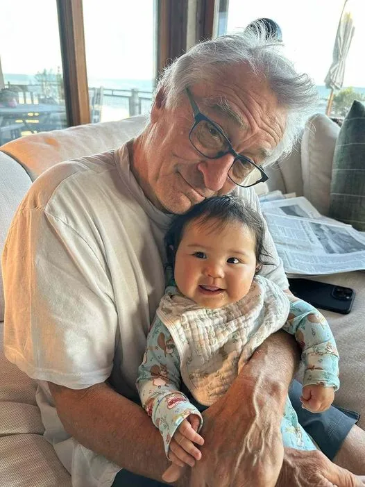 Robert De Niro, 80, and baby daughter Gia, 10 months, snuggle in rare family photo